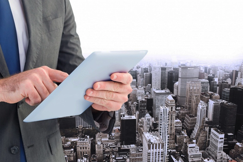 Businessman using tablet cityscape view