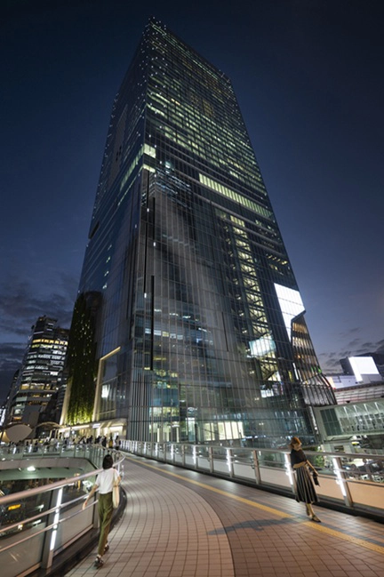 Night view illuminated glass skyscraper